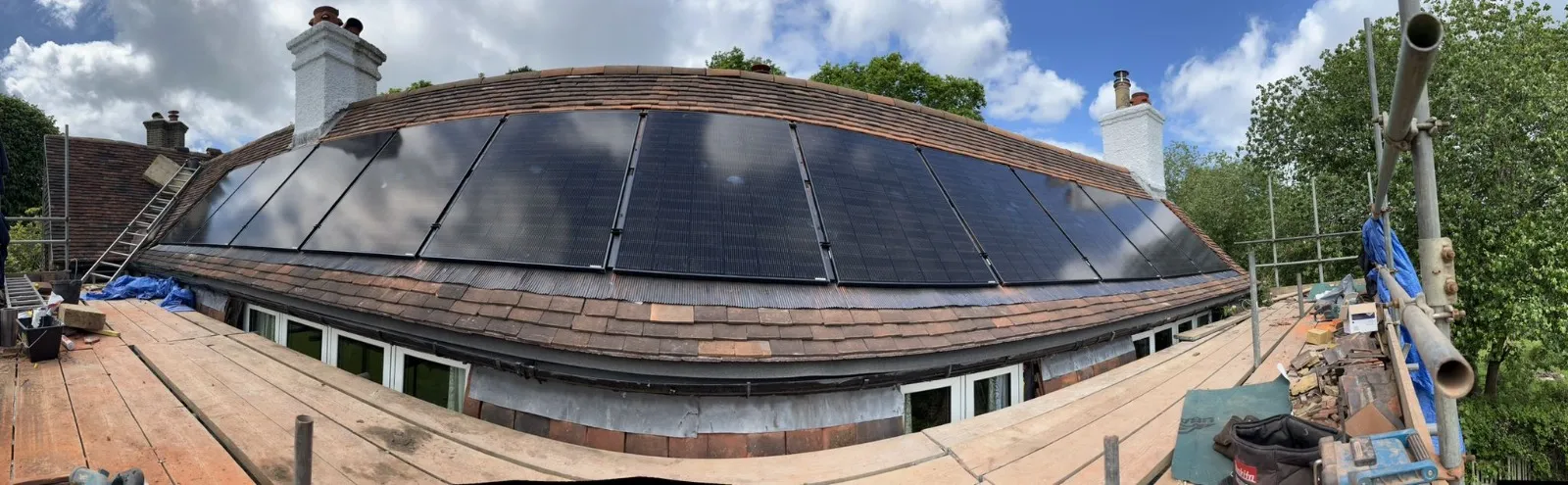 A roof with a solar panel on top of it.