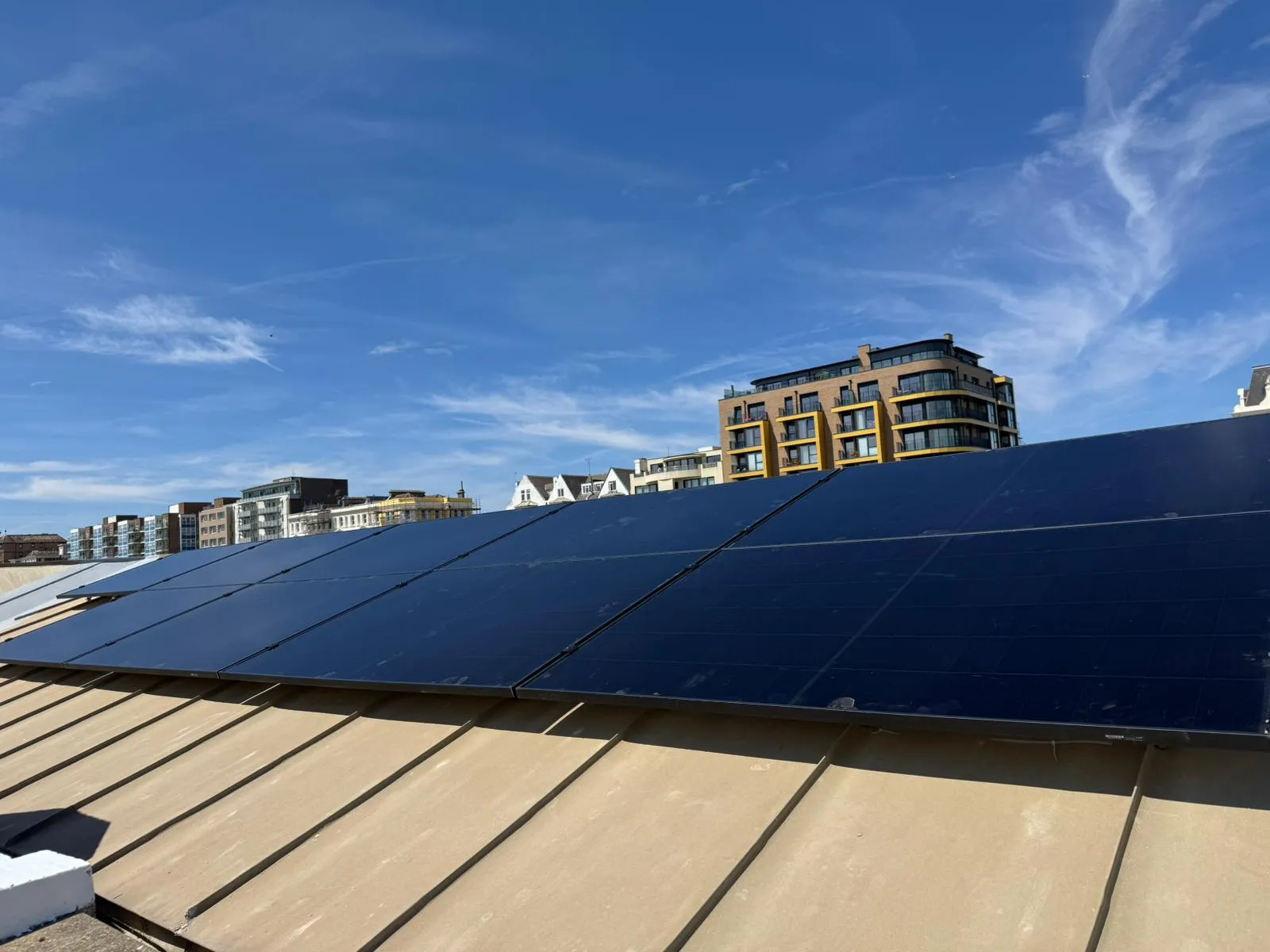 A large solar panel on top of a roof.